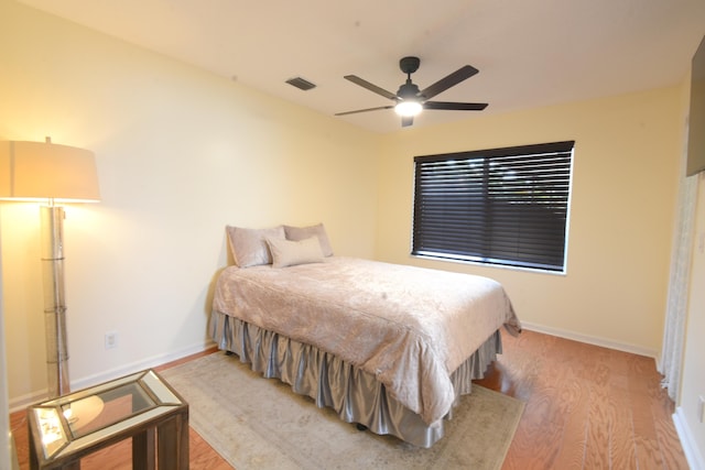 bedroom featuring light hardwood / wood-style flooring and ceiling fan