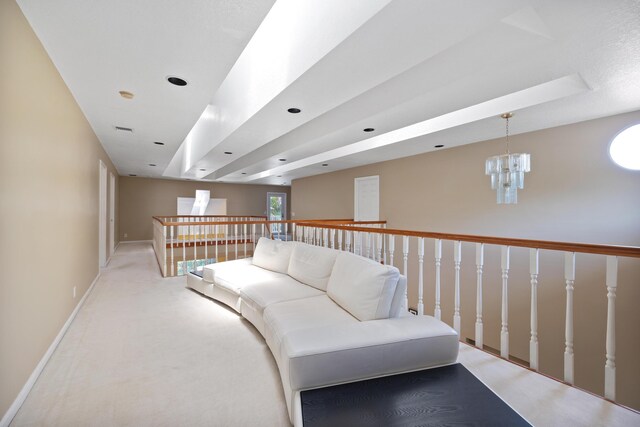 living area with light carpet and a notable chandelier