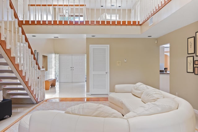 living room with a high ceiling