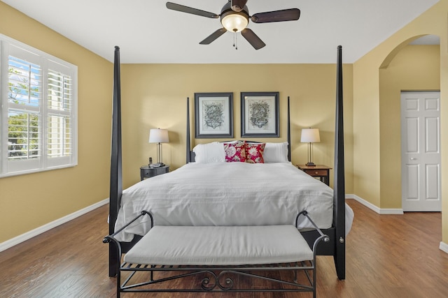 bedroom with hardwood / wood-style floors and ceiling fan