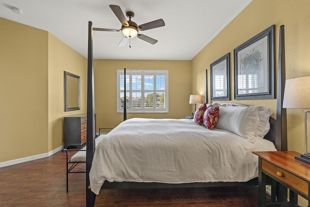 bedroom featuring ceiling fan and dark wood-type flooring