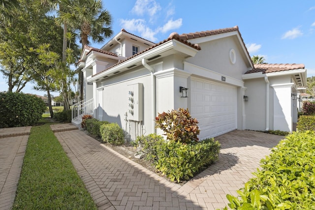 view of side of property with a garage