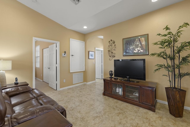 living room featuring vaulted ceiling