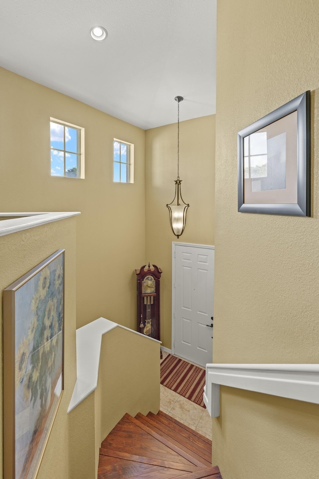 staircase featuring tile patterned flooring