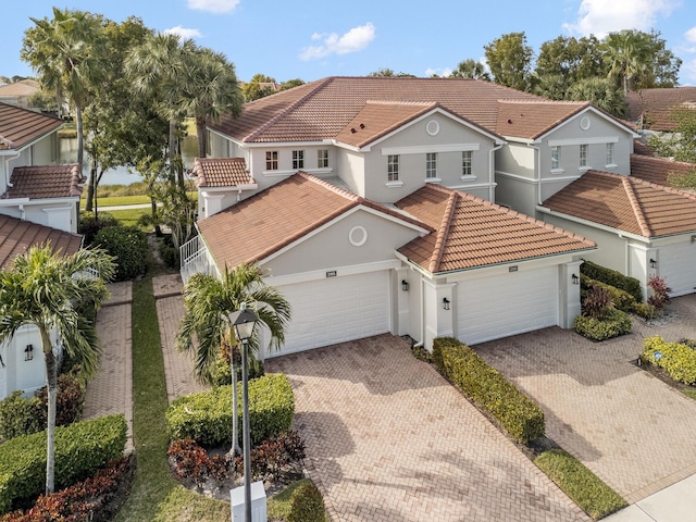 mediterranean / spanish-style home featuring a garage