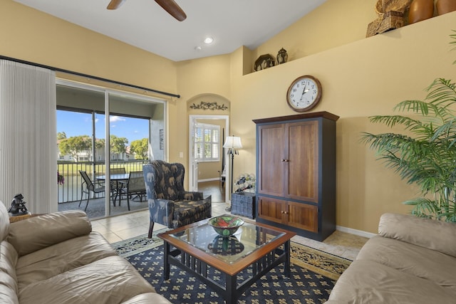 living room featuring ceiling fan and light tile patterned floors