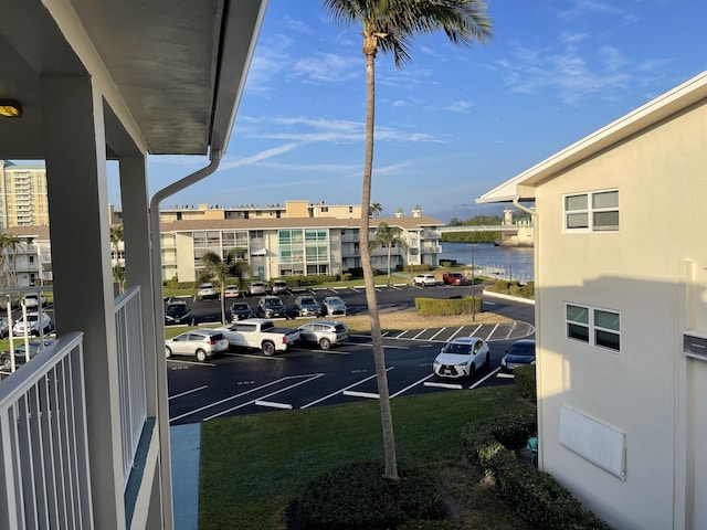 view of vehicle parking featuring a water view