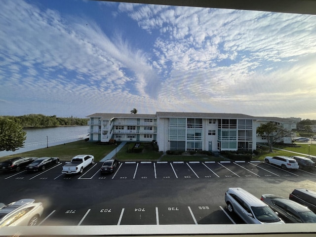 view of building exterior with a water view