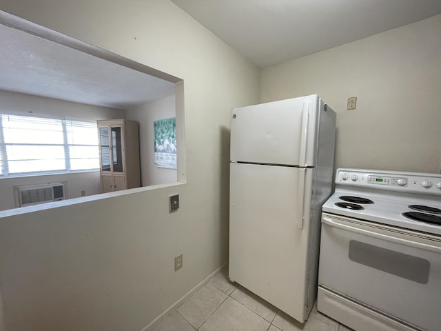 kitchen with light tile patterned floors and white appliances