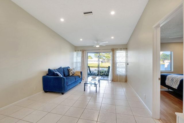 tiled living room featuring ceiling fan