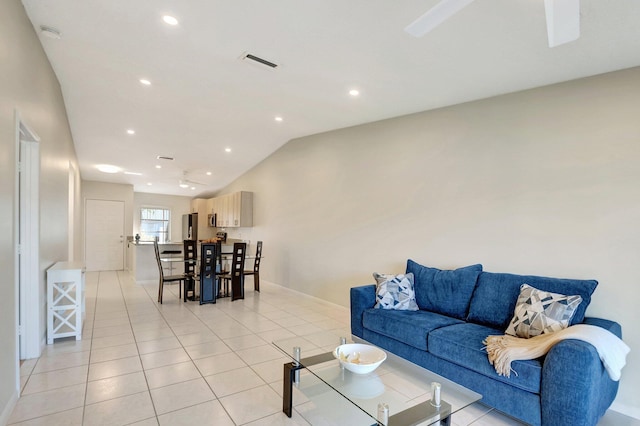 living room featuring light tile patterned floors and lofted ceiling