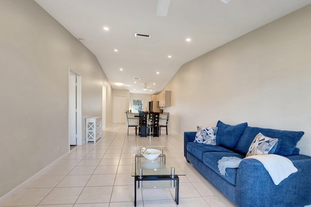 living room with light tile patterned flooring and lofted ceiling