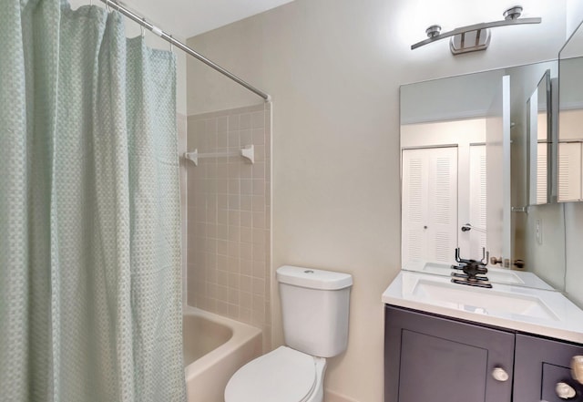 full bathroom featuring shower / bath combination with curtain, vanity, and toilet