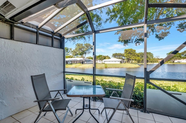 unfurnished sunroom featuring a water view and a healthy amount of sunlight