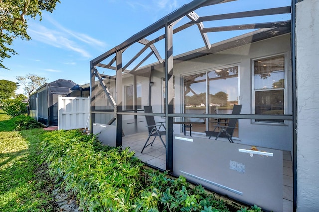 view of patio with a lanai