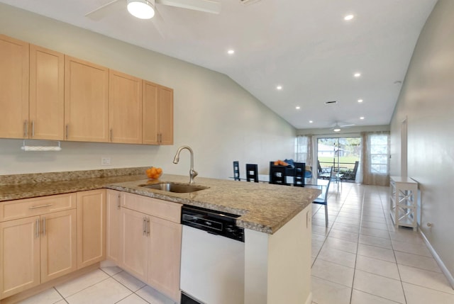 kitchen featuring kitchen peninsula, light brown cabinetry, white dishwasher, sink, and lofted ceiling