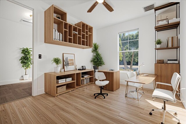 office with ceiling fan and light hardwood / wood-style flooring