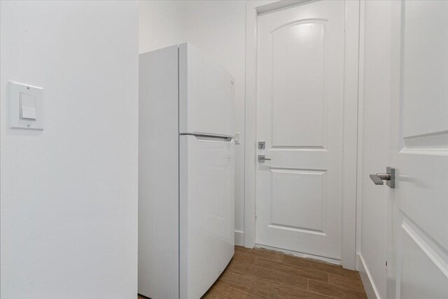 unfurnished bedroom featuring a closet, ceiling fan, and light wood-type flooring