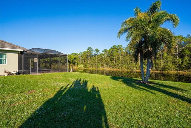 view of side of property with a garage and a yard