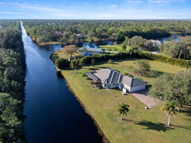 dock area featuring a water view and a yard