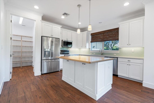 kitchen featuring white cabinetry, appliances with stainless steel finishes, and a kitchen island