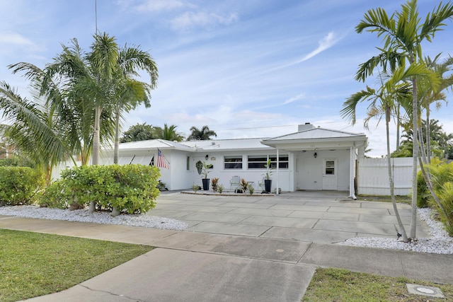 view of front of home with a carport