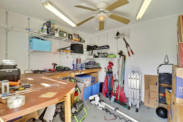 misc room featuring ceiling fan and concrete flooring