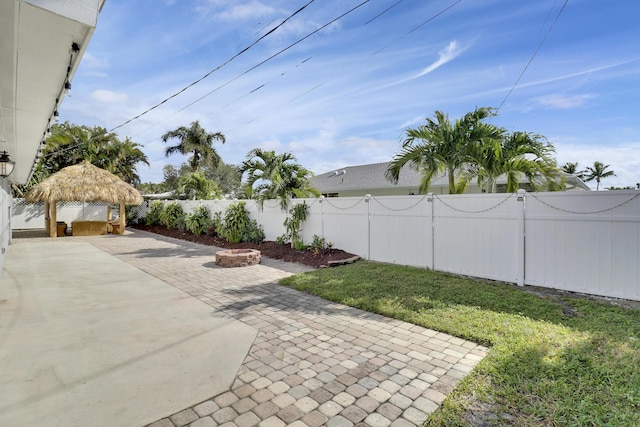 view of yard with an outdoor fire pit, a gazebo, and a patio