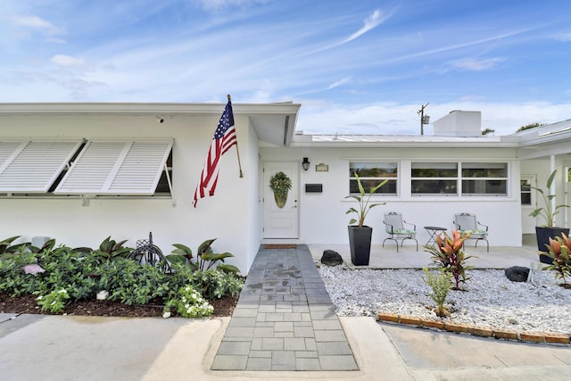 view of front of home with a patio area