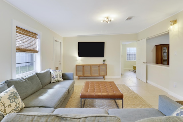 tiled living room with plenty of natural light