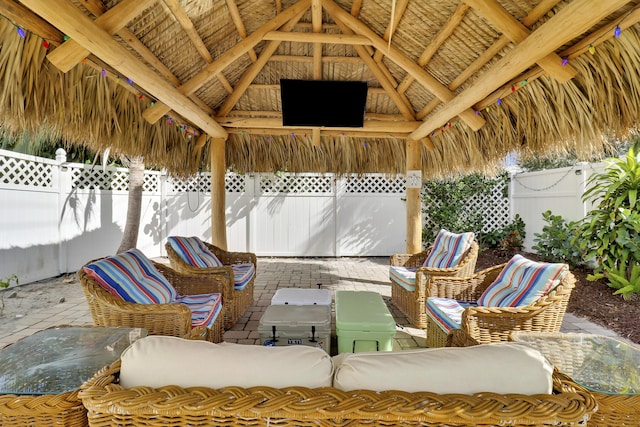 view of patio featuring outdoor lounge area and a gazebo