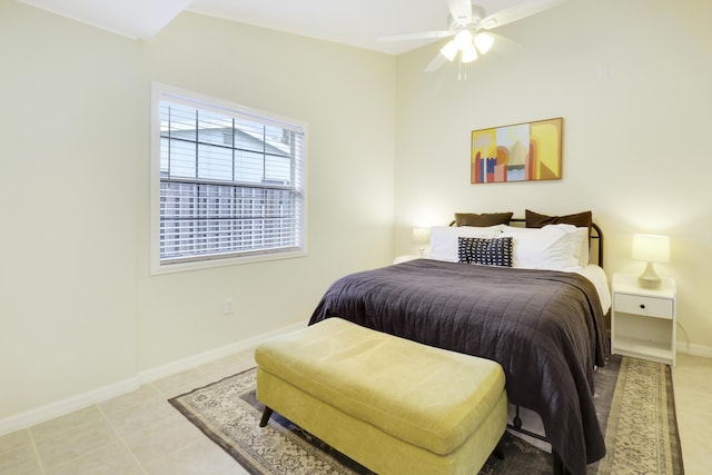 bedroom with ceiling fan and light tile patterned floors