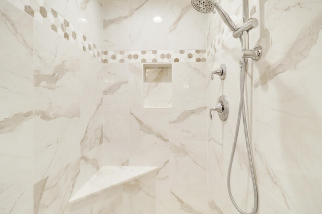 details with a tile shower