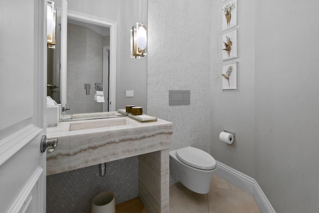 bathroom featuring tile patterned flooring and toilet