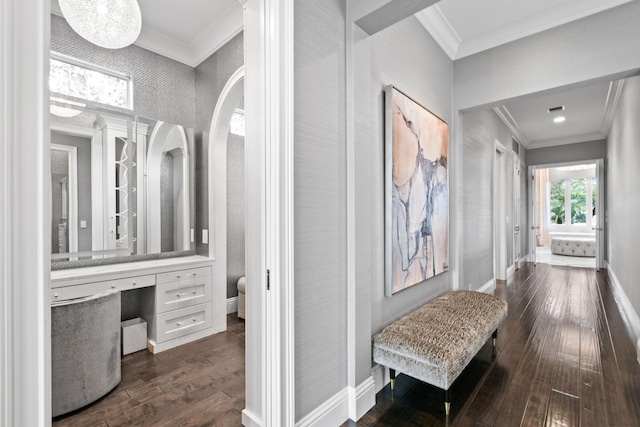 hall with dark hardwood / wood-style flooring and ornamental molding