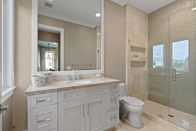 bathroom featuring crown molding, vanity, tile patterned floors, toilet, and walk in shower