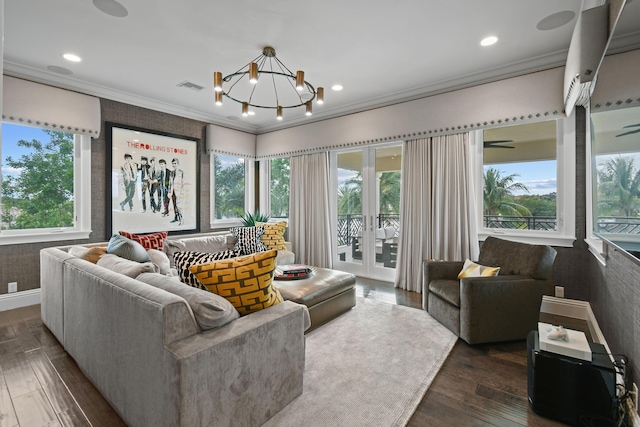13791 Baycliff Dr, Juno Beach, FL 33408 - living area with dark wood finished floors, a chandelier, ornamental molding, and recessed lighting