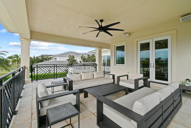 view of patio featuring a balcony, outdoor lounge area, ceiling fan, and french doors