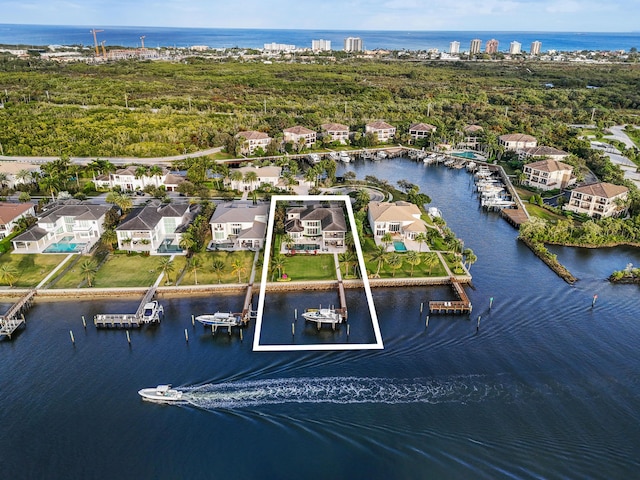 birds eye view of property with a water view