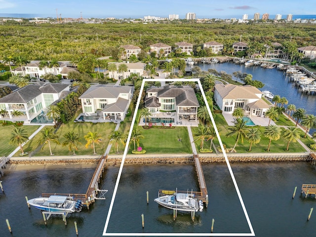 13791 Baycliff Dr, Juno Beach, FL 33408 - aerial perspective of suburban area featuring a large body of water and property boundaries highlighted