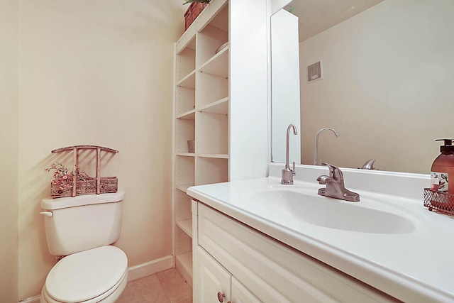 bathroom with tile patterned floors, vanity, and toilet