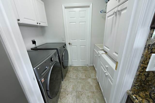 laundry area with cabinets and separate washer and dryer