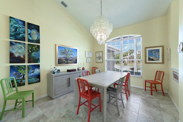 dining space featuring a chandelier and lofted ceiling