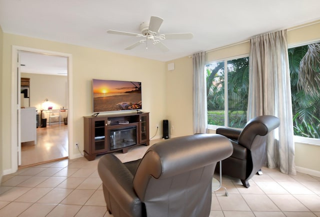 living room featuring light tile patterned flooring and ceiling fan