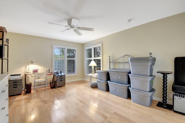 misc room with ceiling fan and light hardwood / wood-style floors