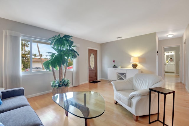 living room with light hardwood / wood-style floors