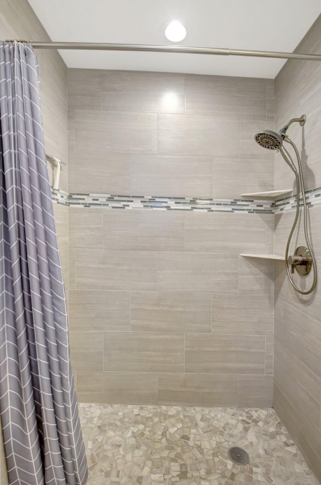 bathroom featuring a shower with curtain