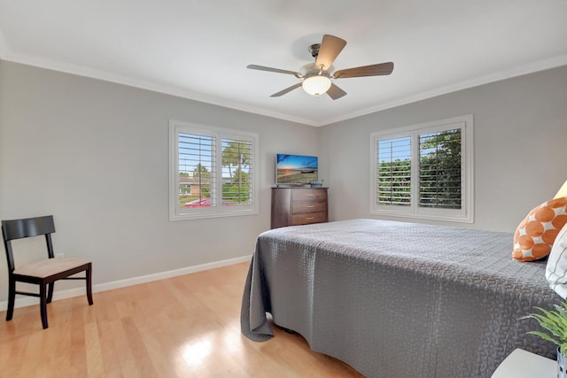 bedroom with ceiling fan, light hardwood / wood-style flooring, and ornamental molding