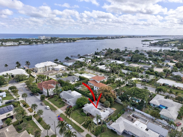 birds eye view of property featuring a water view