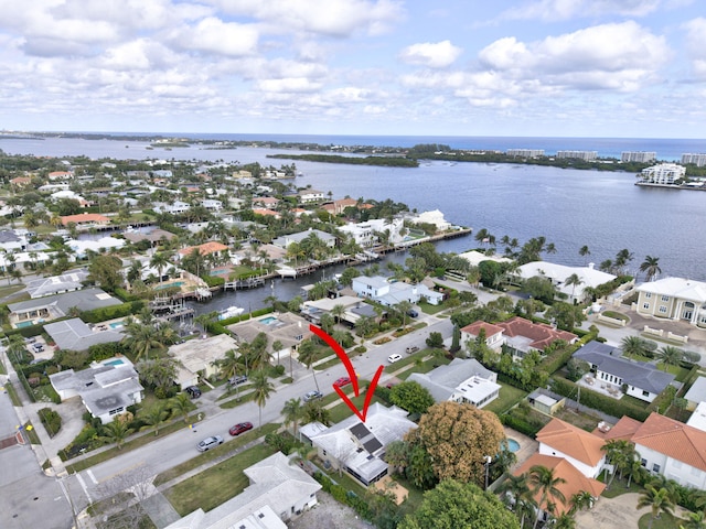 birds eye view of property featuring a water view